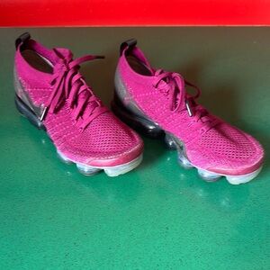 Nike Pink Athletic Shoes with Breathable Mesh and Cushioned Soles
